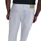 A person is shown from the back wearing light blue IB2992085 Nike SB Skate Trousers, loose fit straight leg, paired with a black shirt, highlighting the rear pockets and waistband of the pants.