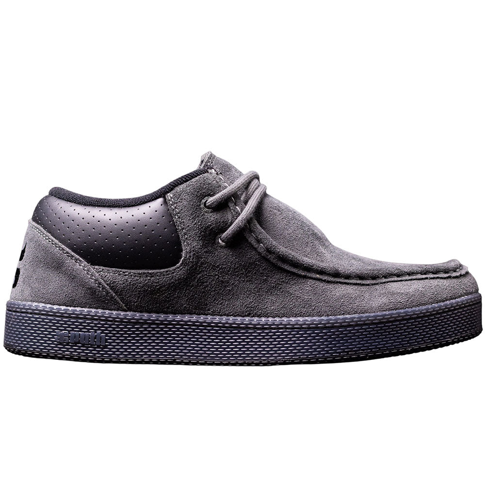 Introducing the Cats Gray Suede Black I Path Shoes Skateboarding: a gray suede lace-up sneaker featuring a cupsole construction, a textured black rubber sole, and a perforated leather section on the heel. Displayed in side profile against a white background.
