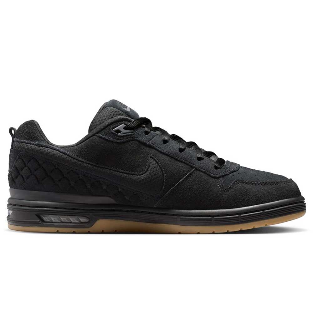 The IQ6827001 Black Gum Light Brown Paul Rodriguez Zoom Air Low Suede Skateboarding Shoe features a black suede finish, quilted heel, black laces, Zoom Air cushioning for comfort, and a tan rubber sole, seen from the side.