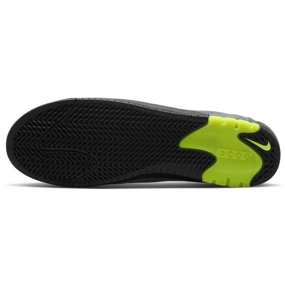 The image shows the black rubber outsole of the IR1887002 Black Neon Yellow Anthracite Air MAX Ishod Nike SB Skateboarding Shoes, featuring a neon yellow heel, small Swoosh logo, and a wavy tread pattern designed for traction and grip.