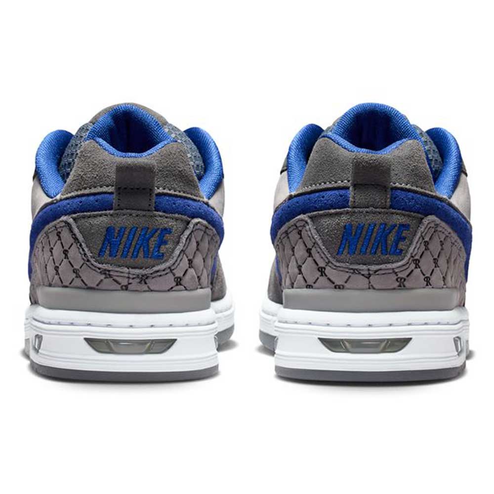 Back view of IU7835001 Flint Grey Deep Royal Blue Paul Rodriguez Zoom Air Low Suede Skateboarding Shoes showing gray suede with blue accents, white soles, and NIKE embroidered in blue on the heels plus a textured lower heel pattern.