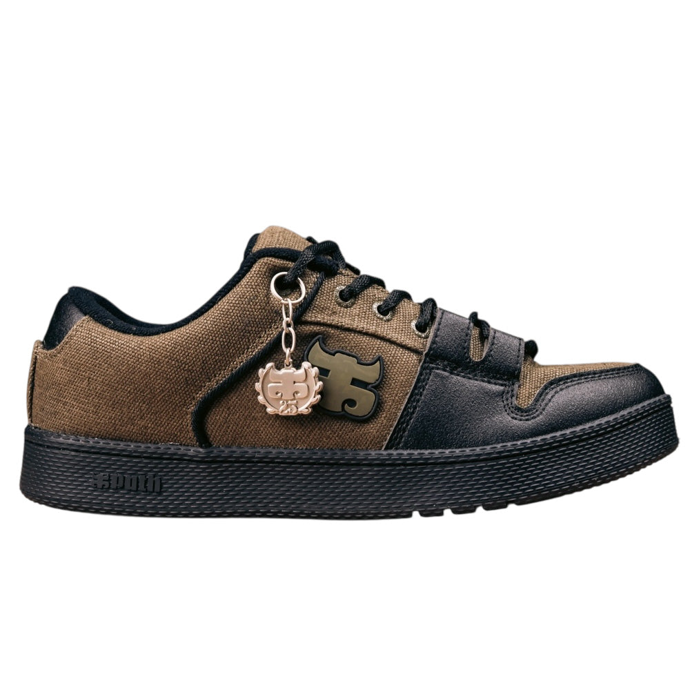 The Cricket Green Waxed Hemp I Path Shoes Skateboarding is a brown and black low-top skate shoe with a synthetic upper, black laces, black sole, a metallic gear-shaped charm on the eyelet, and a 55 logo on the side.