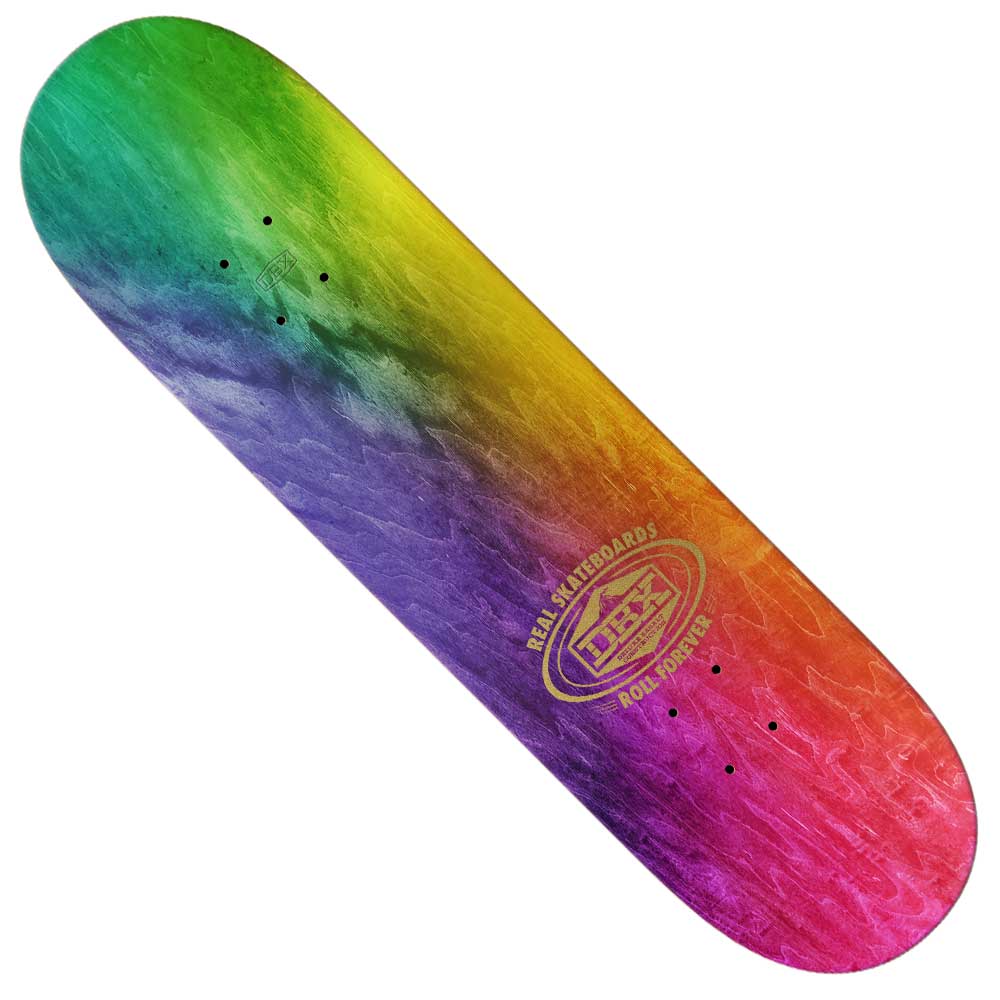 The Ishod DBX Cat Slick 8.25 Real Skateboards Deck features a vibrant gradient of green, yellow, orange, purple, and red with a gold "Real Skateboards" logo and "Rock Johner" text—ideal for fans of Ishod's signature style.