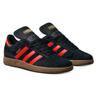 A pair of JH8134 Black Orange Gum Busenitz Adidas Skateboarding Suede Shoes, featuring black suede, orange stripes, and gum soles, displayed side by side on a white background.
