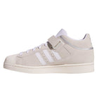 The JH8141 White Silver White Pro Shell Mid Trainers ADV by Adidas feature a suede upper, white stripes, a rubber toe cap, Velcro strap, and flat off-white sole for vintage basketball-inspired skateboarding style.