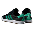 The JH8143 Nora Black Green Suede Adidas Skateboarding Shoes feature green accents, green heel panels, and three green stripes, blending vintage-inspired style with Nora Vasconcellos' signature flair.