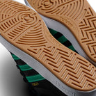 Close-up of the gum sole pattern with concentric circles and zigzags on the JH8143 Nora Black Green Suede Adidas Skateboarding Shoes, featuring vintage-inspired black and green uppers with white midsoles.