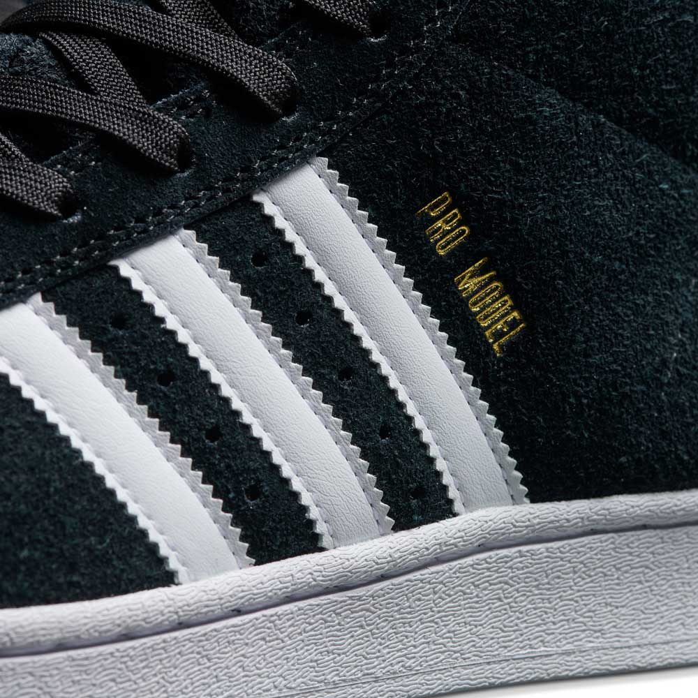 Close-up of JH8146 Black White Gold Suede Pro Model ADV Adidas Skateboarding Shoes, featuring white leather stripes, gold branding, and a textured white midsole—an iconic skate shoe choice.
