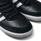 Close-up of the JI 0846 Black White Gum Tyshawn II Adidas Skateboarding Shoes, featuring black leather and suede uppers with white side stripes, perforations, black laces, and classic white soles.