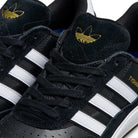 Close-up of JI 0846 Tyshawn 2 II Adidas Skateboarding Shoes in black and white with gum sole, white stripes, black laces, gold Adidas trefoil logo on the tongue, and "TYSHAWN" printed in gold on the side. Leather suede upper.