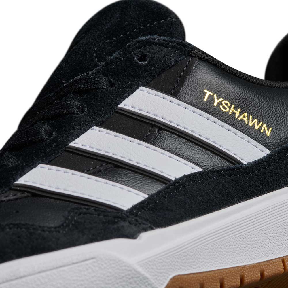 Close-up of the JI 0846 Black White Gum Tyshawn 2 II Adidas Skateboarding Leather Suede Shoes, featuring black suede, white stripes, a white midsole, gum outsole, and gold TYSHAWN text—built for style and performance.
