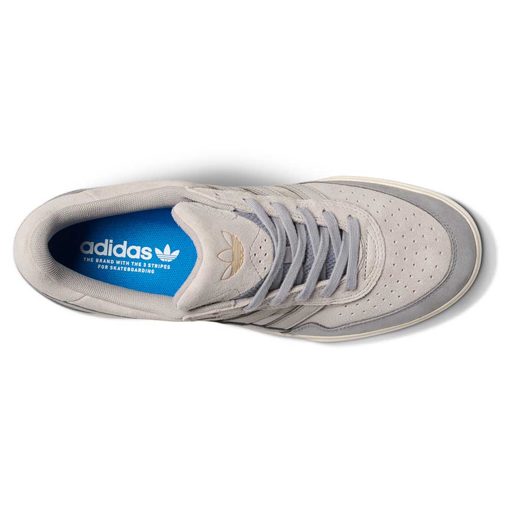 Top view of the JI0848 Granite White Tyshawn 2 II Adidas Skateboarding Shoe, featuring gray leather and suede, a blue insole with Adidas logo and text, gray laces, and perforated toe.