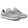 A pair of Adidas Tyshawn 2 II JI0848 Granite White Skateboarding Shoes featuring leather-suede in grey, light blue laces, black side stripes, cream midsole, light blue outsole, and gold "TYSHAWN" print—ideal for stylish, comfortable skateboarding.