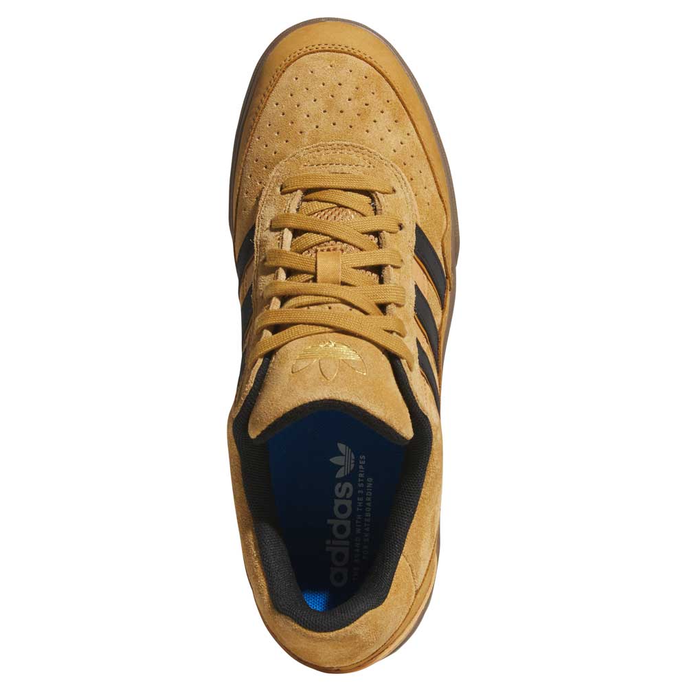 Top view of the JI0851 Mesa Black Gum Tyshawn 2 II adidas leather suede skateboarding shoe in tan with black stripes, tan laces, perforated toe, blue insole with white adidas logo, and classic cupsole construction.