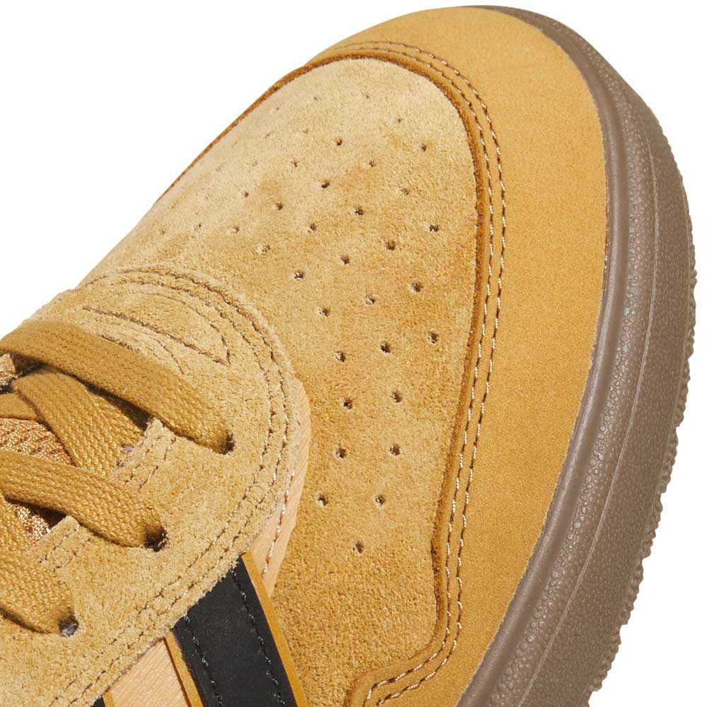Close-up of the front of the JI0851 Mesa Black Gum Tyshawn 2 adidas skateboarding shoe in tan suede with perforations, textured stitching, tan laces, a brown cupsole, and a partially visible black side stripe.