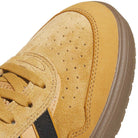 Close-up of the front of the JI0851 Mesa Black Gum Tyshawn 2 adidas skateboarding shoe in tan suede with perforations, textured stitching, tan laces, a brown cupsole, and a partially visible black side stripe.