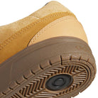 Close-up of the heel and sole of the JI0851 Mesa Black Gum Tyshawn 2 II Adidas Skateboarding Shoes, featuring tan and brown leather suede, detailed stitching, textured cupsole construction, and a circular tread pattern underneath.