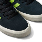 Close-up of JP5655 Black Neon Green Busenitz Vulc Suede Adidas Skateboarding Shoes, featuring black suede uppers, white textured soles, black laces, and neon green stripes on the sides, displayed on a white background.