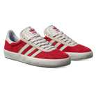 The JP5861 Red White Gold Gazelle ADV Adidas Skateboarding suede shoes feature a red upper, white soles and laces, beige stripes, gold GAZELLE text, and Adidas logos—perfect for casual wear or skateboarding.