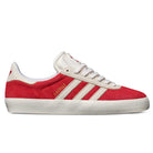 The JP5861 Red White Gold Gazelle ADV Adidas Skateboarding Suede Shoes feature a red and white suede upper, white laces, gold GAZELLE text, three white stripes, and a textured white sole, designed for skateboarding.