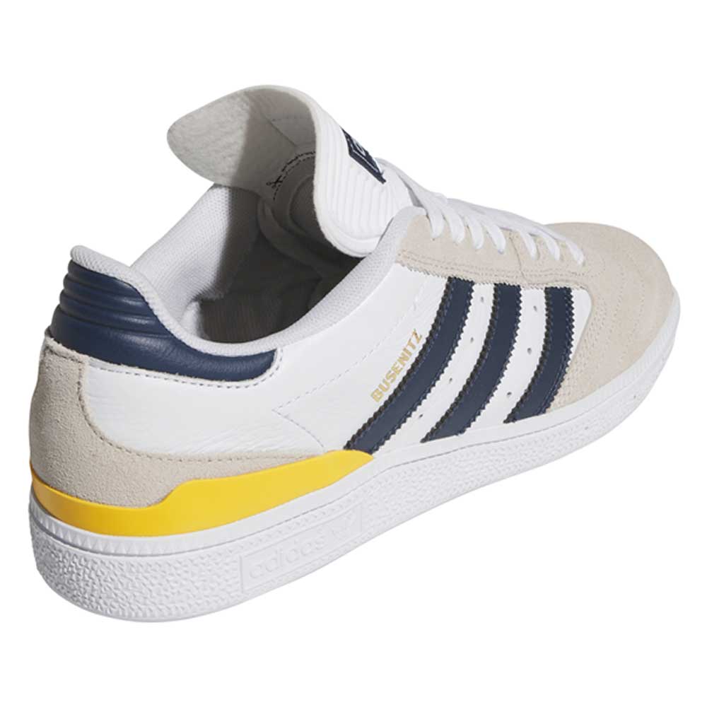 The JP8604 Brown Navy Busenitz Adidas Skateboarding Suede Shoes feature navy stripes, a navy heel detail, yellow side accent, and beige suede overlays. The gold BUSENITZ label appears next to the stripes.