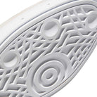 Close-up of the JP8604 Brown Navy Busenitz Adidas Skateboarding Suede Shoes' sole, showing geometric grip patterns—ideal for skateboarding, with a durable suede upper.