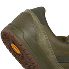 Close-up of the back and side of the JQ1132 Olive Strata Shadow Olive Tyshawn 2 II Adidas Skateboarding Shoes, featuring suede and premium leather textures, a brown sole, Lightstrike midsole, and TYSHAWN in gold on the side.