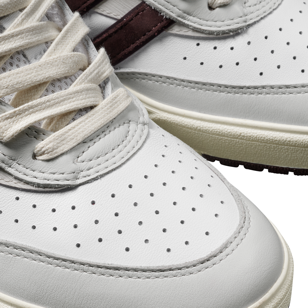 Close-up of JQ1620 Crystal White Brown Zach Saraceno Tyshawn 2 II Adidas Skateboarding Shoes featuring premium leather, perforated toe box, cream laces, maroon stripe, Lightstrike midsole, and light gray/cream accents on a white background.
