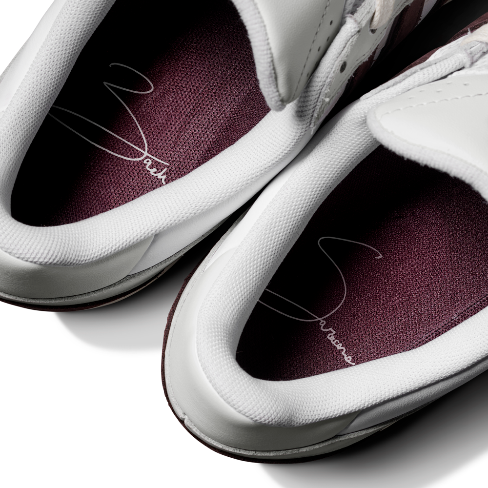 Close-up of two JQ1620 Crystal White Brown Zach Saraceno Tyshawn 2 II Adidas Skateboarding Shoes with maroon insoles, white signature design inside, premium leather, and partially visible laces viewed from above.