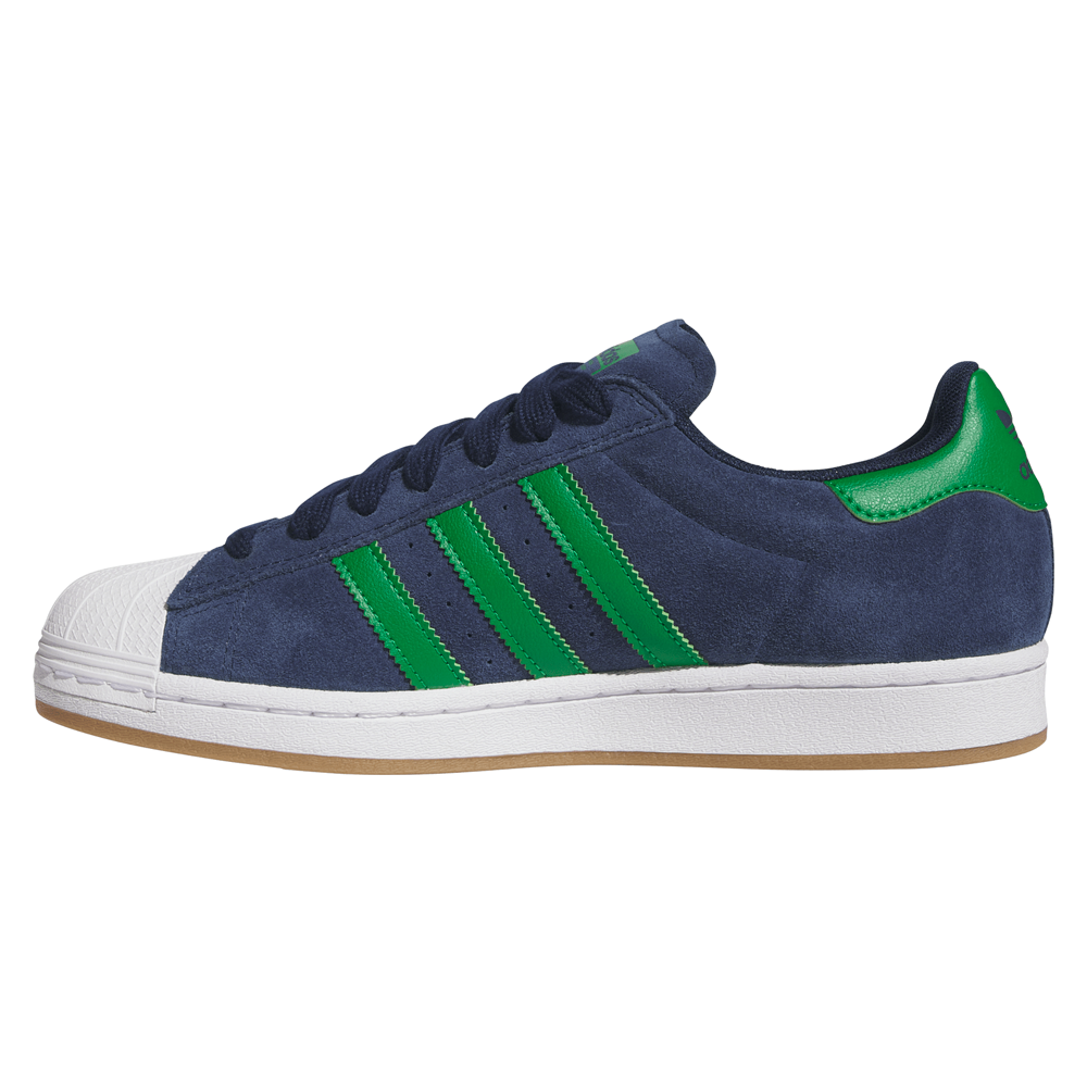 The JQ2098 Navy Green White Superstar ADV Adidas suede skateboarding shoes feature green stripes and heel tab, white rubber toe cap and sole with durable cupsole construction, plus a beige outsole.