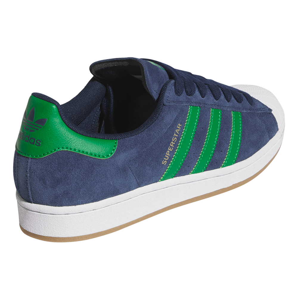 The JQ2098 Navy Green White Superstar ADV Adidas Suede Skateboarding Shoes feature a navy upper with green stripes and heel tab, white cupsole, and gold SUPERSTAR text on the side, shown from a rear-side angle.