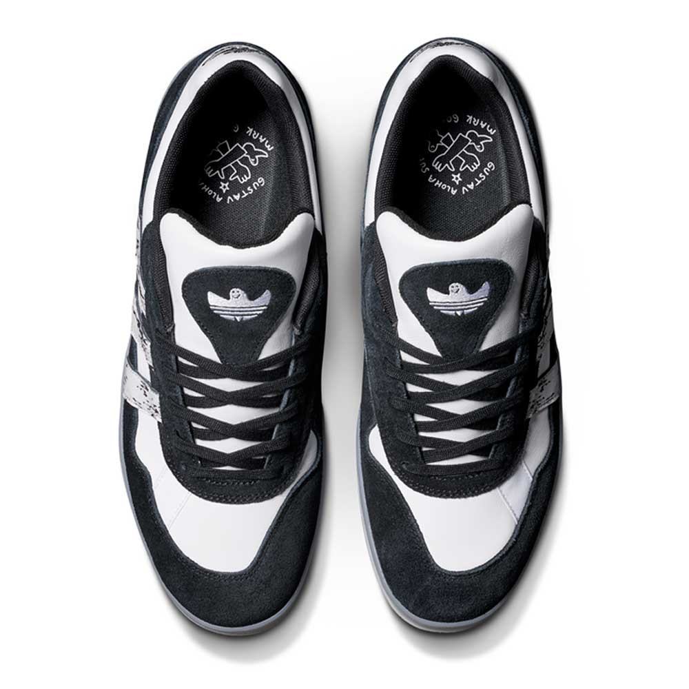 Top view of JR7101 Gustav Tonnesen Black White Aloha Super suede leather skateboarding shoes with heart accents, a stylized bird on the tongue, and adidas Skateboarding special edition insoles with unique artwork.