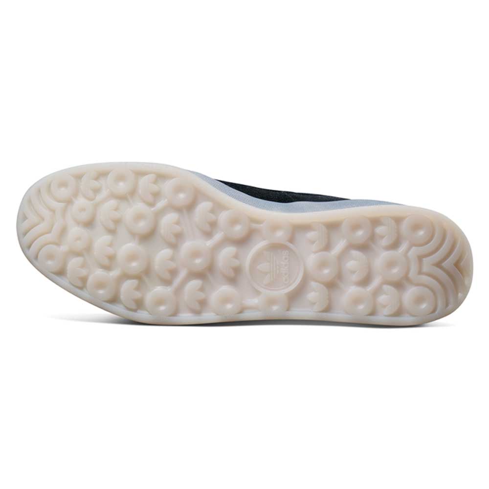 The image shows the outsole of the JR7101 Gustav Tonnesen Black White Aloha Super Suede Leather Skateboarding Shoes, featuring a translucent rubber sole with circular and trefoil grip patterns and an embossed Adidas logo in the center.