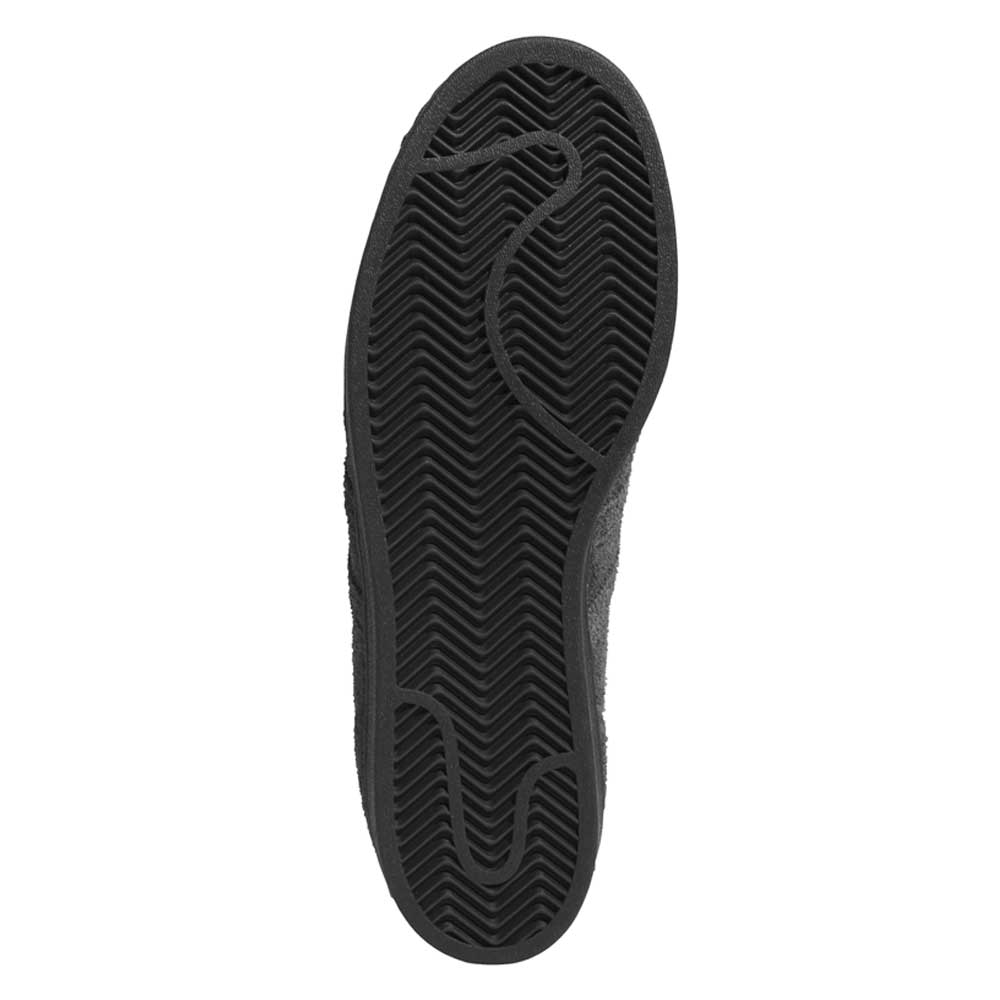The image shows the black rubber outsole of the JR7409 Carbon Purple Superstar ADV Adidas Suede Skateboarding Shoes, with a herringbone tread pattern and curved grooves at the forefoot and heel for traction.