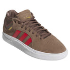 The JR9499 Earth Color Tyshawn Adidas Skateboarding Shoes feature brown suede, red stripes, gold details, brown laces, and a white cupsole. "TYSHAWN" in gold near the ankle marks this Tyshawn Jones signature skateboarding shoe.