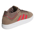 The JR9499 Earth Color Tyshawn Adidas Skateboarding suede shoes feature a brown earth hue, red stripes, white cupsole, gold "TYSHAWN" on the side, low-top design, and visible stitching details.