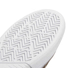 Close-up of the JR9499 Earth Color Tyshawn Adidas Skateboarding Suede Shoe’s white sole, showing a detailed herringbone pattern and raised, textured cupsole edge for signature grip and traction from Tyshawn Jones’ adidas Skateboarding line.