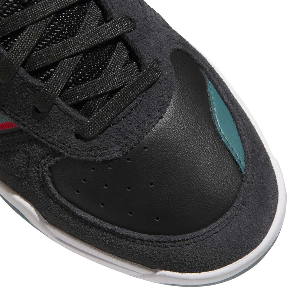 Close-up of the toe area of the JS4307 Adidas Skateboarding Shoe in Core Black, Preloved Teal, and Better Scarlet, featuring suede and leather textures, black laces, a teal accent, and a white cupsole for comfort.