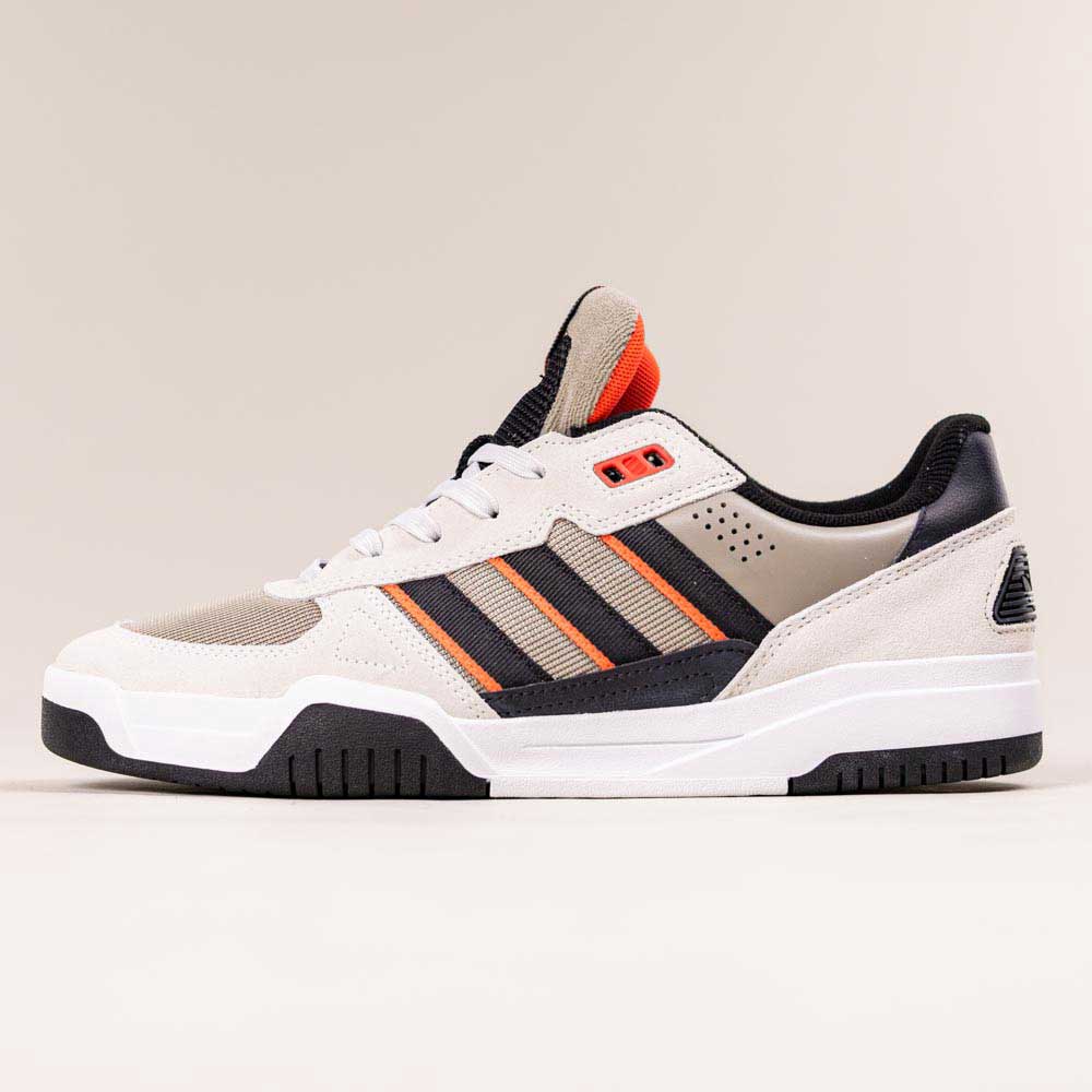 The JS8906 Orbit Grey Core Black Solar Red Tekkira Suede Leather Adidas Skateboarding Shoes feature a beige and white low-top design with black stripes, black heel, white sole, and orange accents for cupsole comfort, shown against a plain background.