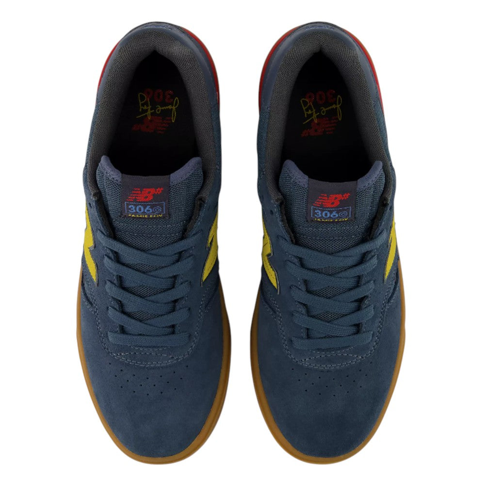 Top view of a pair of navy blue suede Jamie Foy Cup 306 CON New Balance Numeric skateboarding shoes with yellow side logos and durable gum rubber soles.