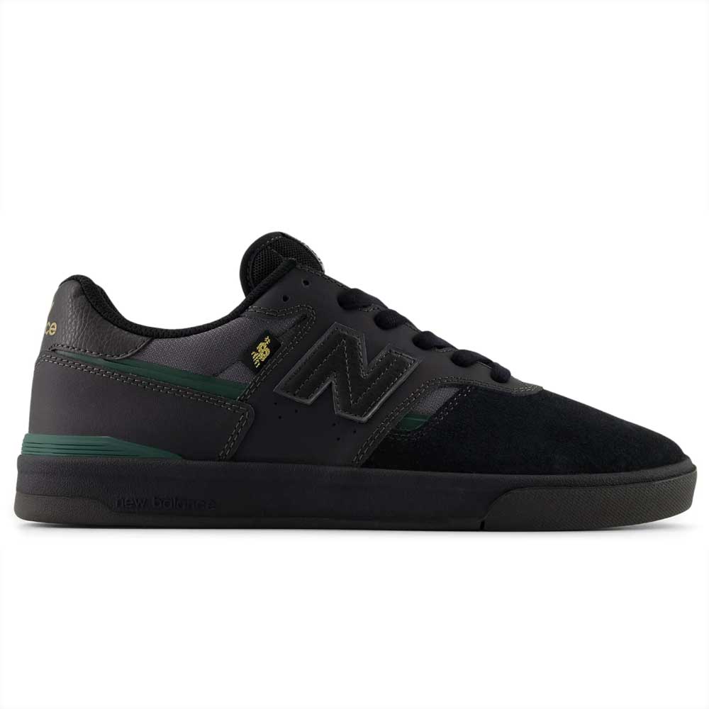 The Black Nightwatch Green Jamie Foy Cup 306 CSP New Balance Numeric suede skateboarding shoes feature green and gold accents, a mesh upper, signature N logo, and a flat vulcanized sole inspired by the Jamie Foy pro model.