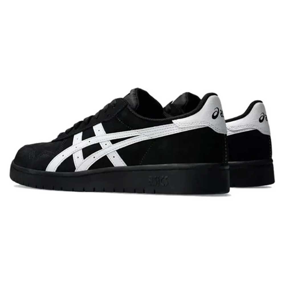 A pair of Japan Pro Asics Black White 1201A92001 suede skateboarding shoes with white stripes and heel detailing, shown from a rear side angle on a plain background.