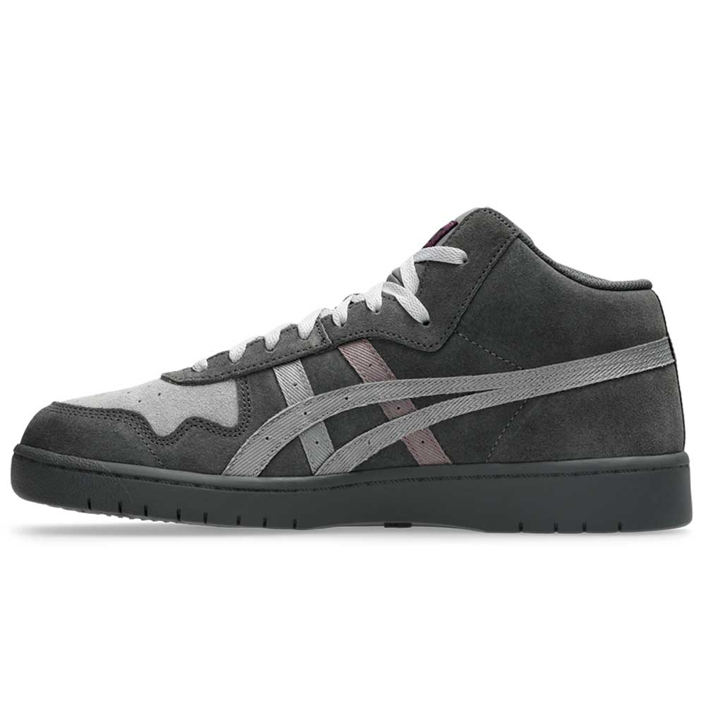 The Japan Pro MT Asics Graphite Gray Cay Red 1203B088 021 is a mid-top suede skateboarding shoe in dark gray with light gray accents, white laces, a matching gray sole, and the signature ASICS stripe on the side.
