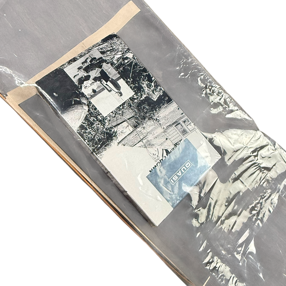 The Justin Henry Quasi VHS and Deck 8.18x31.6 Signed Collectible, wrapped in clear plastic with a black-and-white photo and a small DUALISM label, makes for a sleek signed skateboard collectible.