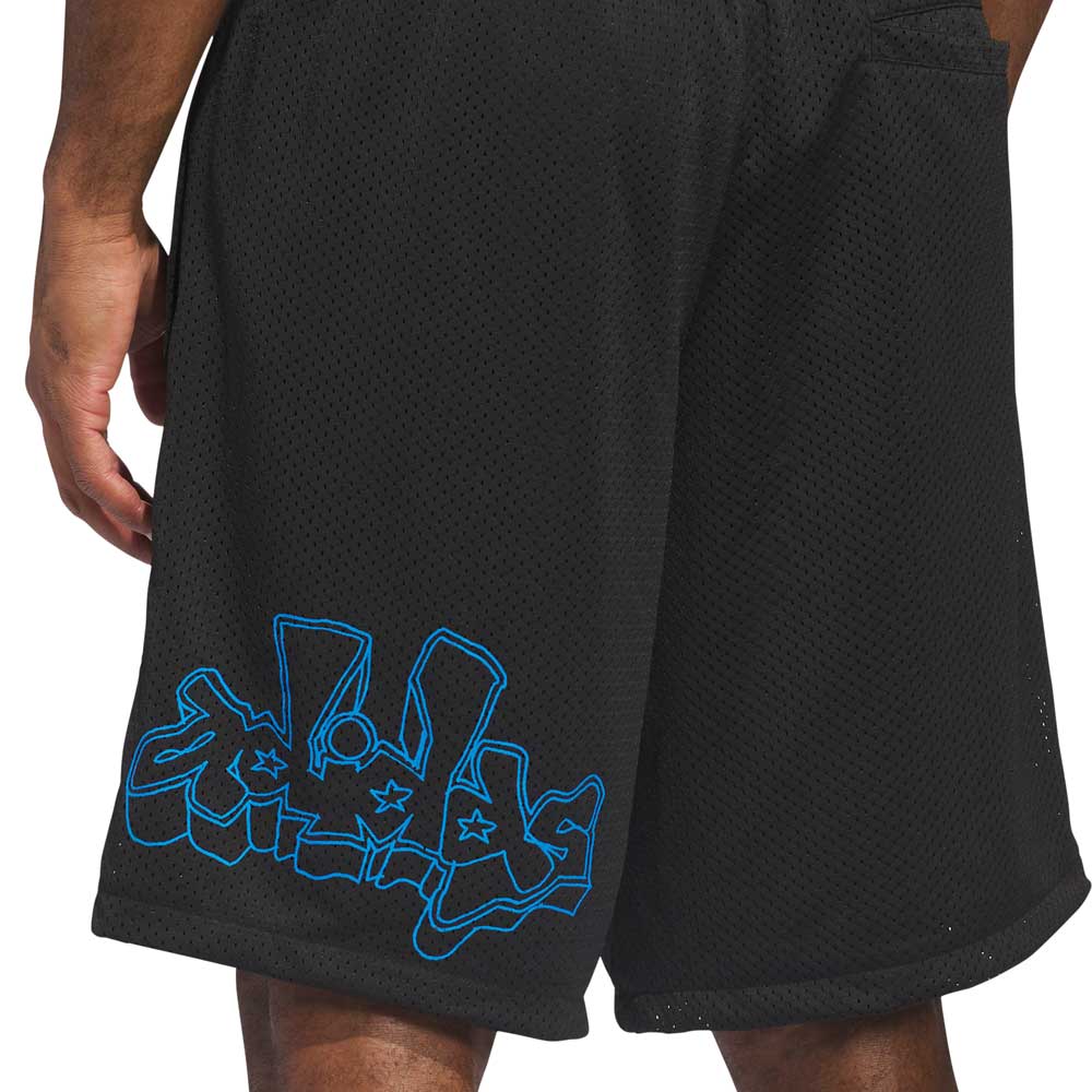 A person wearing KC6308 Kogan Shorts Blue Black from Adidas Skateboarding, featuring blue graffiti-style artwork near the left hem; only their lower torso and upper legs are visible.