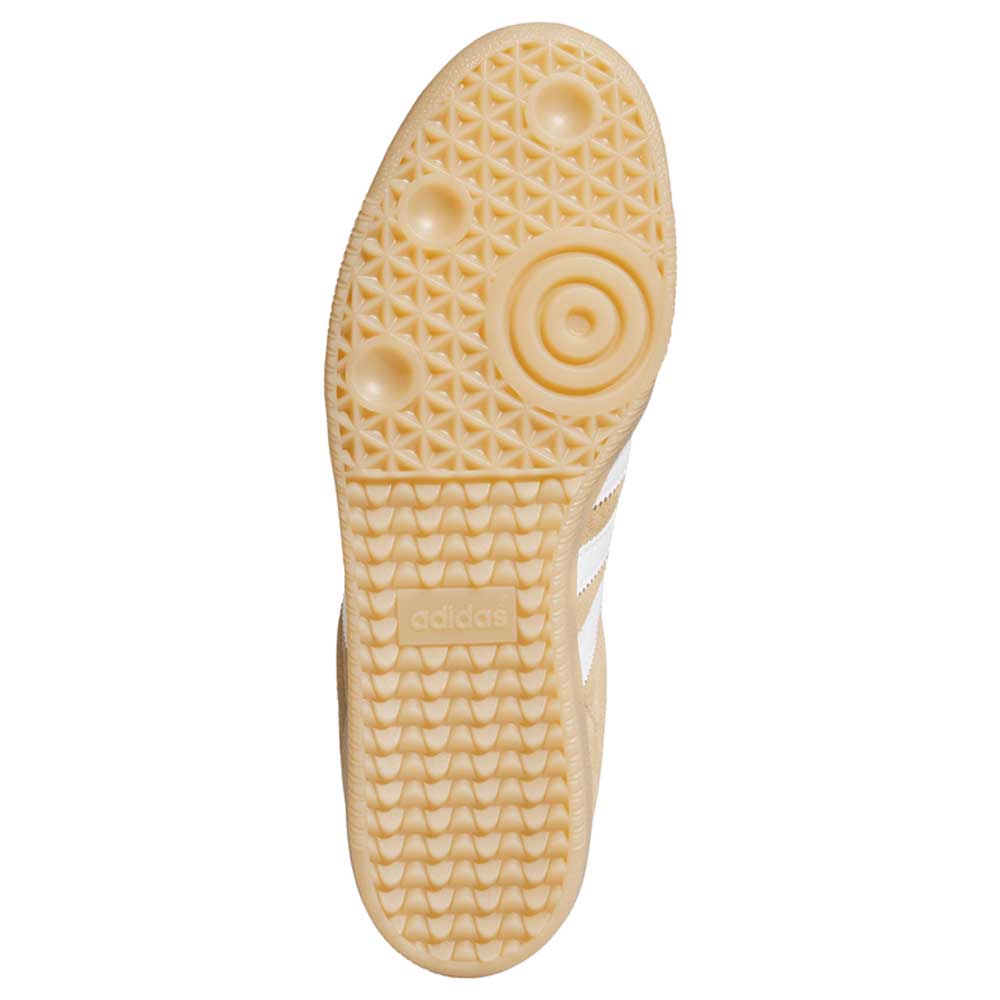 The image shows the textured beige sole of the KI5089 Tan White Samba ADV Adidas Skateboarding Suede Shoe, featuring circular and grid patterns, with the adidas logo embossed near the arch.