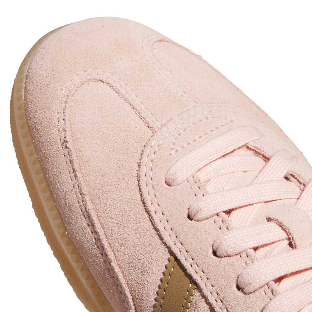 Close-up of the KI5090 Pink Gum Samba ADV Adidas Skateboarding Suede Shoes, featuring pink suede, matching laces, a textured light brown outsole, and a subtle gold stripe detail inspired by the classic Samba ADV style.