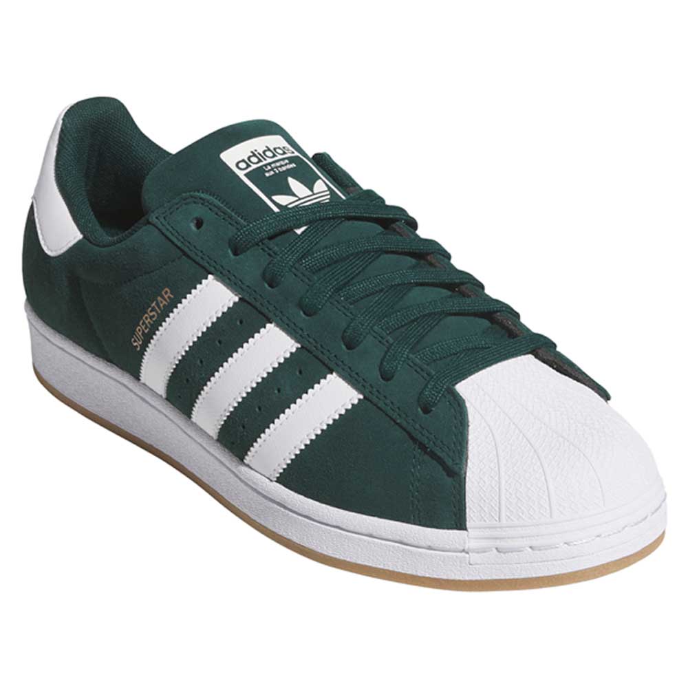 The KI5732 Green White Superstar ADV Adidas Skateboarding Suede Shoes feature classic white stripes, a shell toe, white heel tab, gum sole, and gold "Superstar" text—perfect for skateboarding fans seeking iconic style and performance.