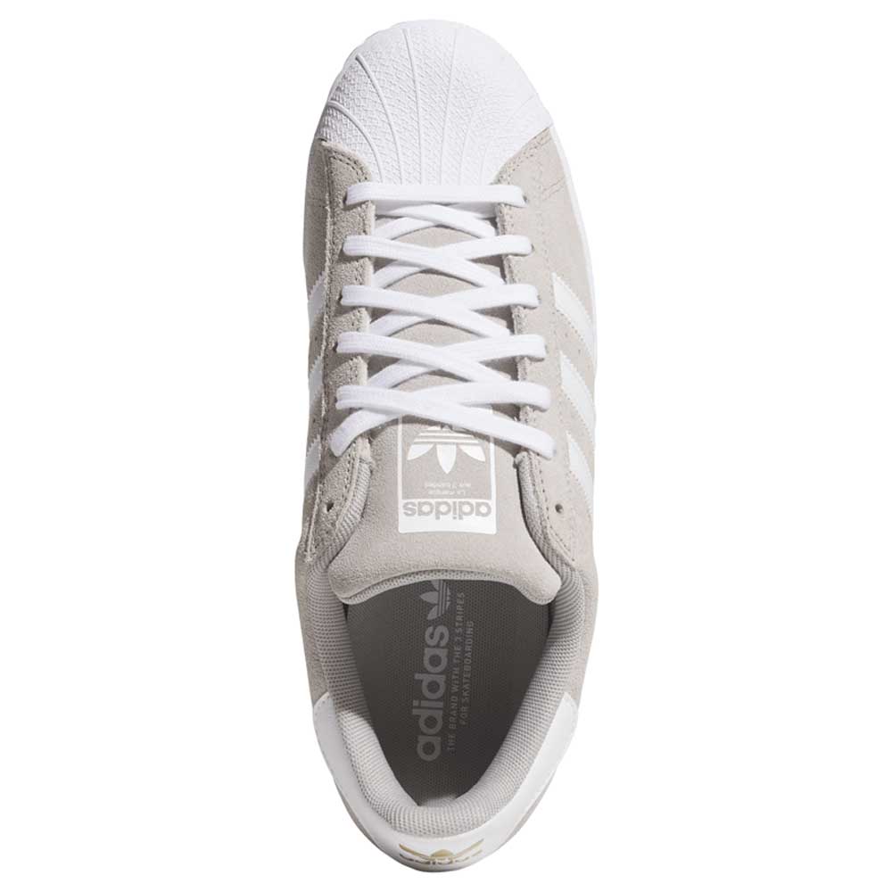 Top view of the KI5733 Gray White Superstar ADV Adidas Skateboarding Suede Shoes, featuring white laces, toe cap, and three white stripes. The adidas logo appears on the tongue and inside, showcasing its classic design.