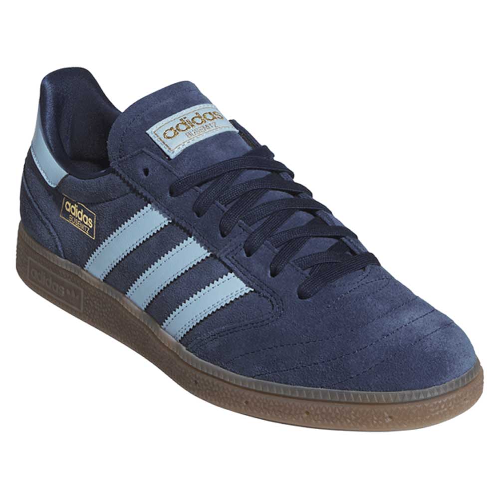 The KJ5478 Blue Gum Busenitz Vintage Adidas Skateboarding Suede Shoes feature a navy upper, light blue stripes, gold accents, dark blue laces, and a brown rubber sole—ideal for stylish comfort at the skate park or beyond.